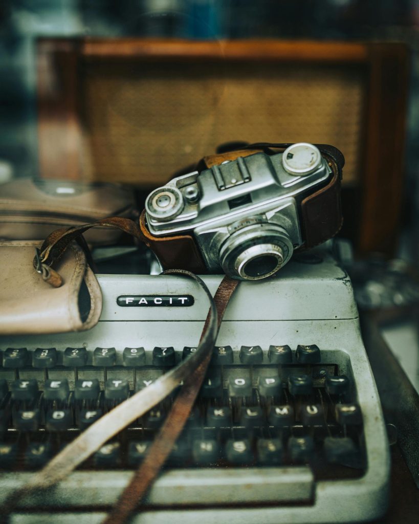 Vintage typewriter and camera